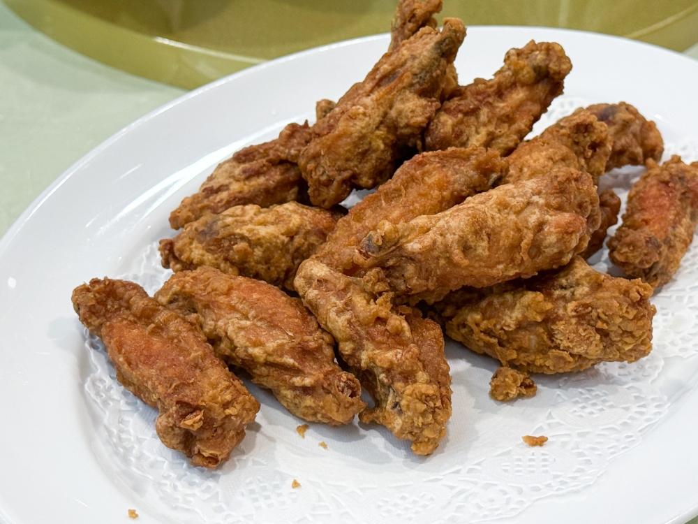 278019 Prawn Paste Fried Chicken is the ultimate ugly delicious food with its crunchy exterior hiding moist meat and a hit of ginger juice. — Picture by Lee Khang Yi