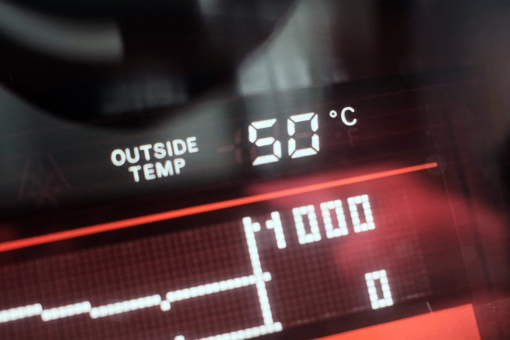 278923 A dashboard display shows an external temperature of 50 degrees Celsius outside a vehicle in Dubai May 23, 2025. — AFP pic