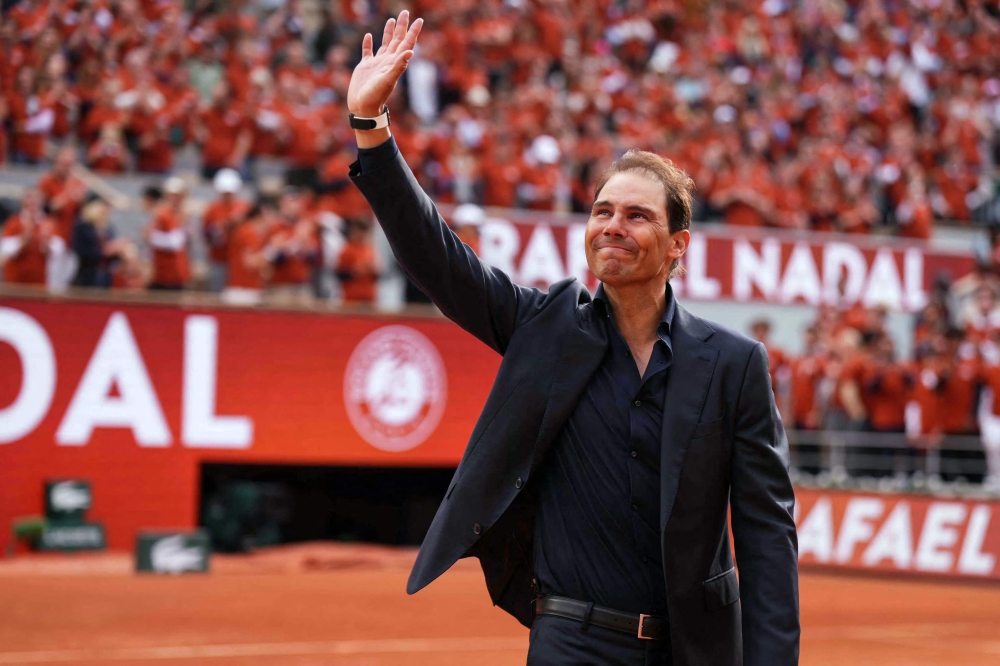279172 Former Spanish player Rafael Nadal waves to the crowd during a ceremony honouring his career during the French Open tennis tournament on Court Philippe-Chatrier at the Roland-Garros Complex in Paris yesterday. — AFP pic