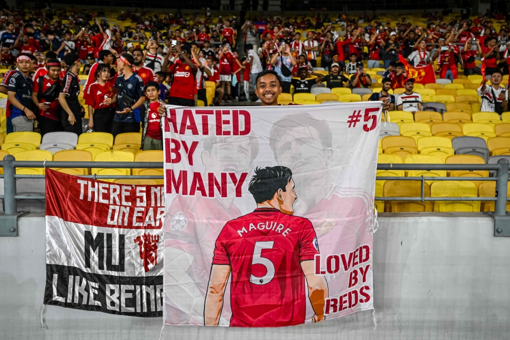 279678 Fans cheer before the exhibition friendly football match between Manchester United and ASEAN All-Stars at the National Stadium Bukit Jalil in Kuala Lumpur on May 28, 2025. — AFP pic