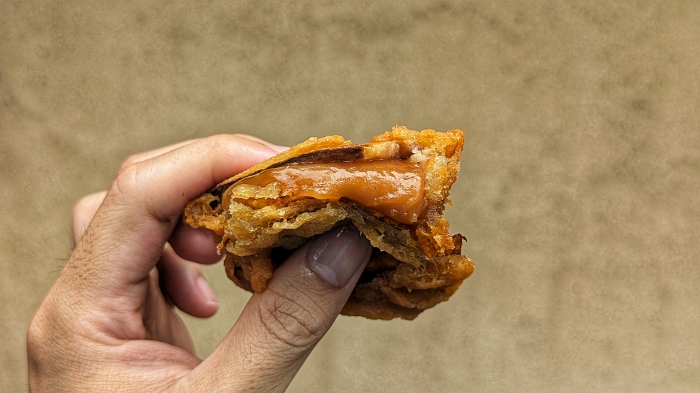 280207 The ‘nian gao’ used hovers between oozey and sticky. — Picture by Ethan Lau