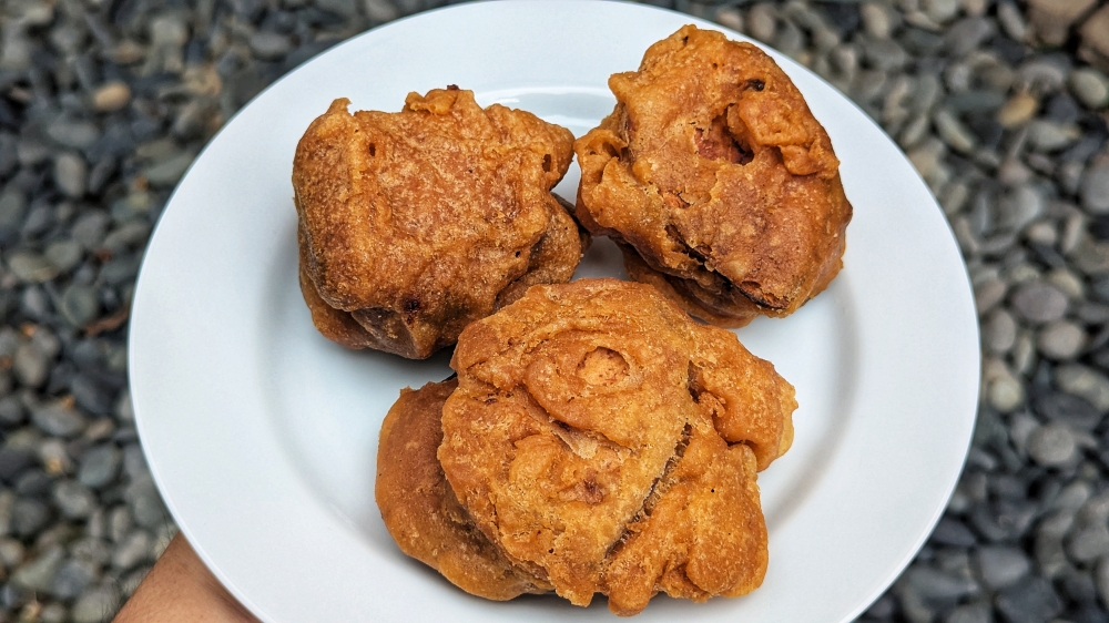 280208 The ‘kuih bakul’ looks huge, but it’s mostly air from the puffy batter. — Picture by Ethan Lau