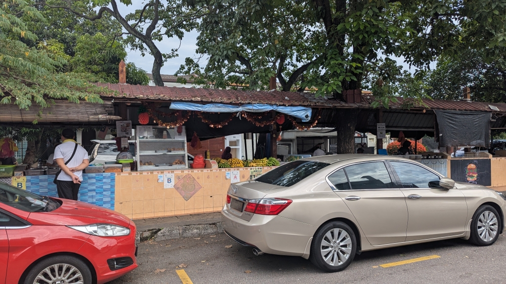 280209 Look for the stall with loads of bananas. — Picture by Ethan Lau