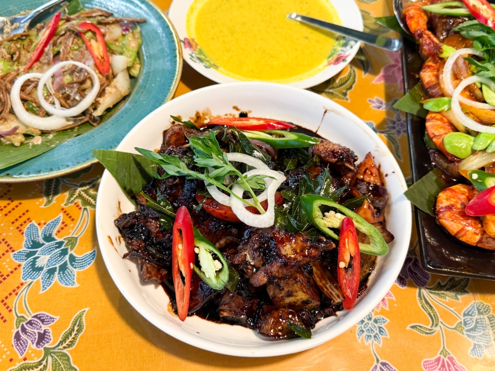 Ayam Masak Itam Labu Labi is a different type of soy sauce dish, using a glossy dark soy sauce that is not overpoweringly sweet. — Picture by Lee Khang Yi