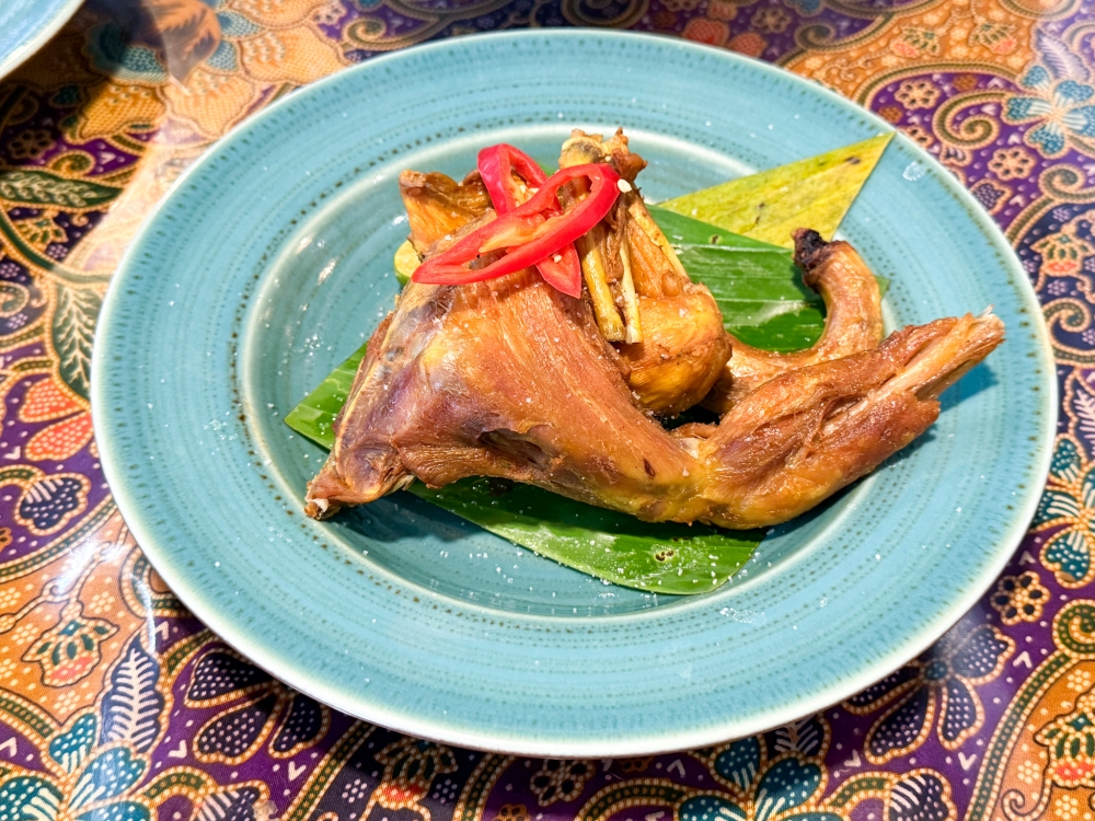 The chicken like this Ayam Kampung Goreng tends to be fried until its a little hard to bite. — Picture by Lee Khang Yi