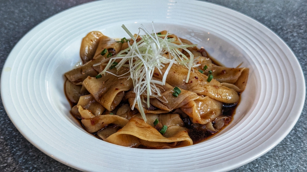 Slick, cold noodles that pack just a touch of heat. — Picture by Ethan Lau