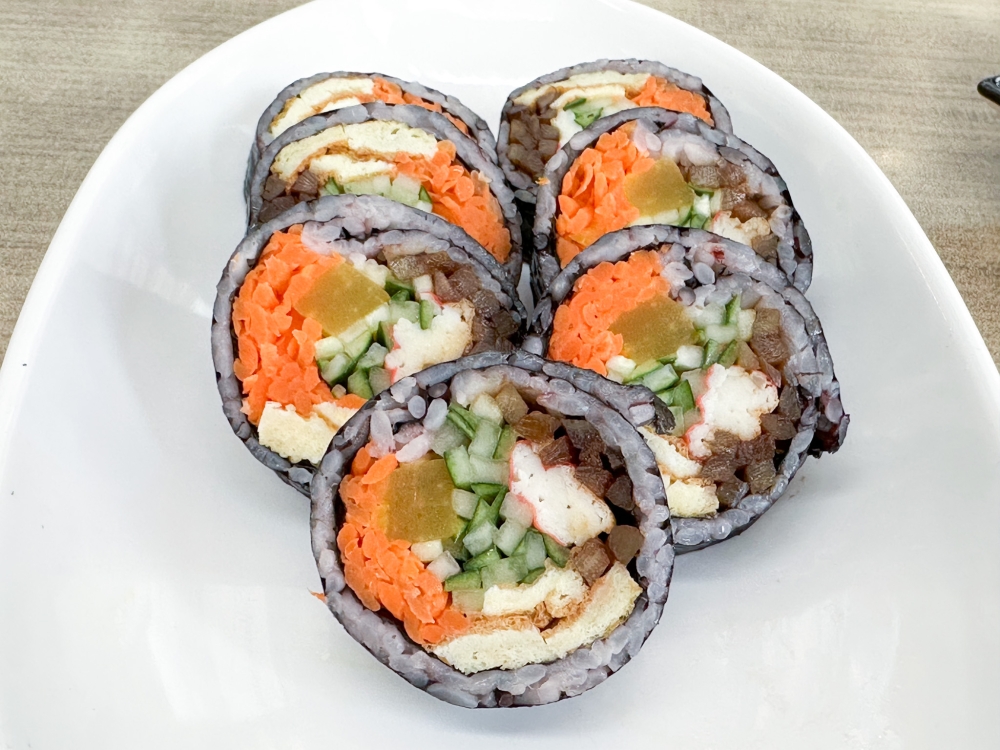 ‘Gimbap’ here is superb with a higher ratio of vegetables, pickles and protein to rice, all encased in seaweed lightly smeared with sesame oil. — Picture by Lee Khang Yi