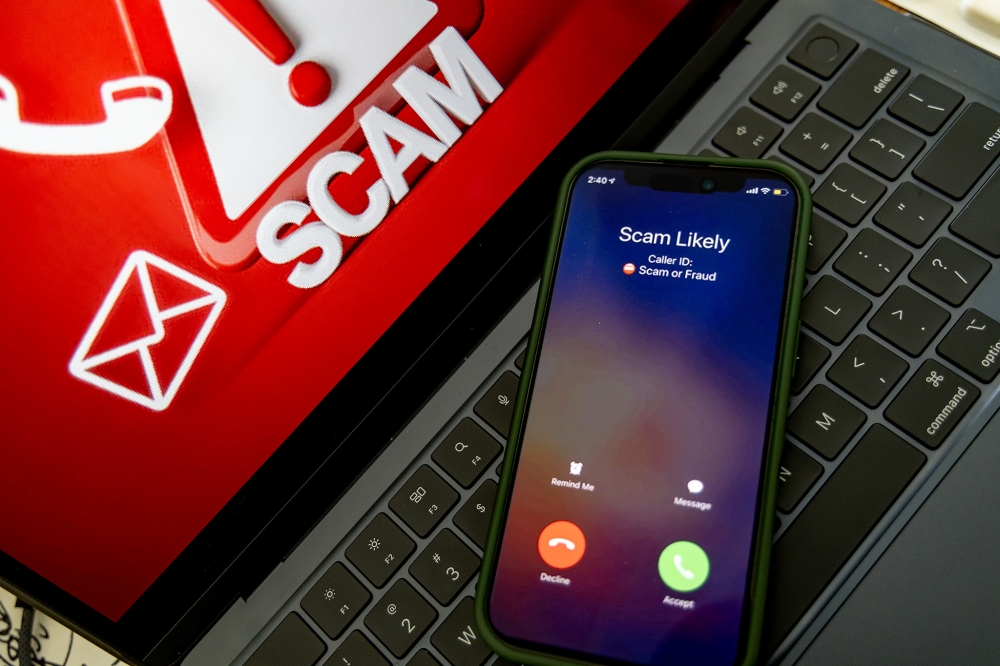 Members of the public can reach the NSRC by dialling 997, which serves as the national emergency hotline for reporting scam-related incidents. — Picture by Firdaus Latif