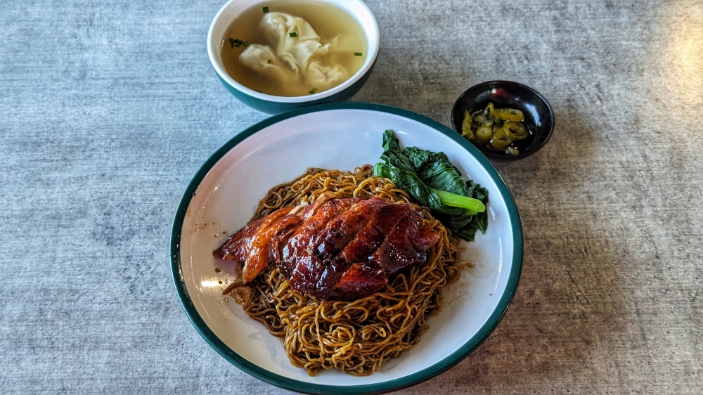 269559-1 The roast duck ‘wantan mee’ comes with a bowl of ‘wantan’ soup and green chilli.
