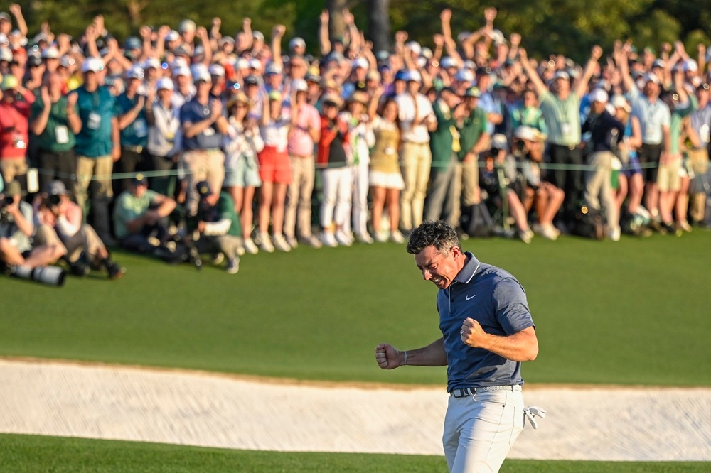 271703-3 Rory McIlroy rewrote golf’s history books by becoming only the sixth player to complete the career Grand Slam following an emotional victory at the Masters Tournament. — Getty Images pic
