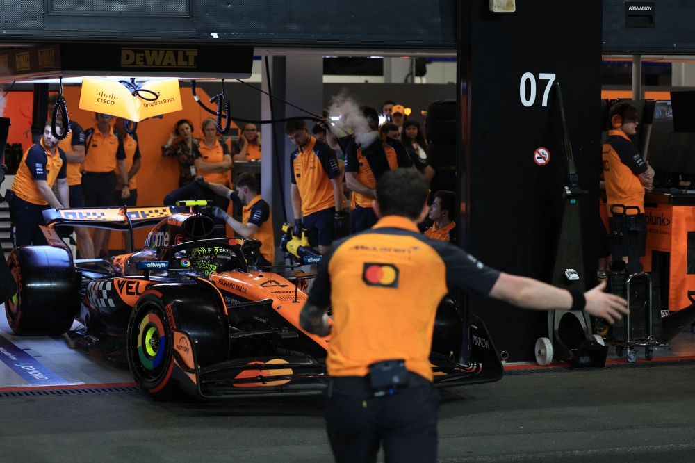 272233-3 McLaren's British driver Lando Norris is ushered out of the garage during the qualifying round for the 2025 Saudi Arabia Formula One Grand Prix at the Jeddah Corniche Circuit on April 19, 2025. — AFP pic