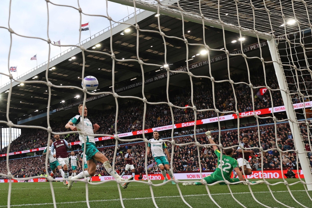 Aston Villa's Dutch defender Ian Maatsen (right) scores the team's second goal during the English Premier League football match with Newcastle United at Villa Park in Birmingham, central England on April 19, 2025. — AFP pic