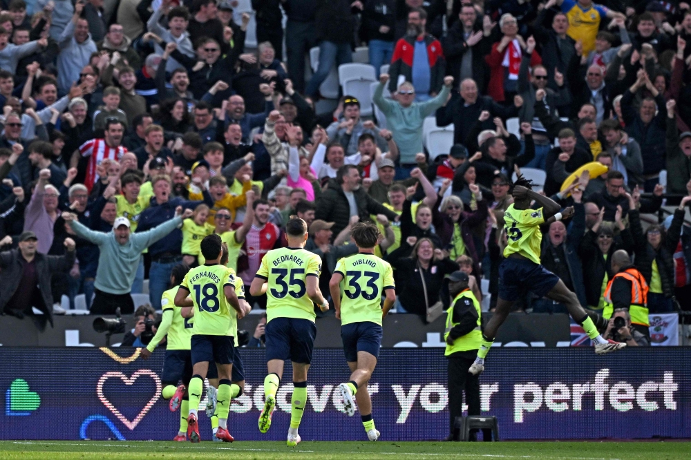 Southampton's French midfielder Lesley Ugochukwu (right) celebrates after scoring the equalising goal during the English Premier League football match between West Ham United and Southampton at the London Stadium, in London on April 19, 2025. — AFP pic