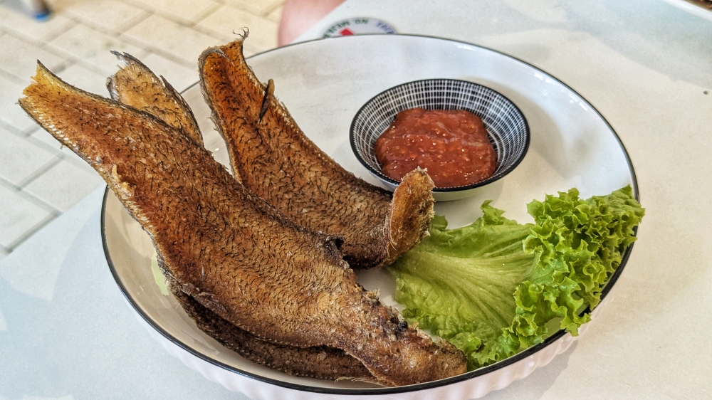 Some parts of the fried tongue fish are crispy enough to crunch through entirely. — Picture by Ethan Lau