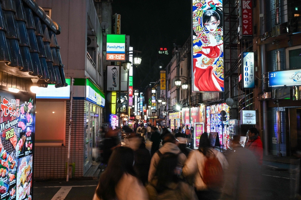 272339 This photo taken on March 31, 2025 shows a general view of the red-light entertainment area of Kabukicho in the Shinjuku district of Tokyo. — AFP pic