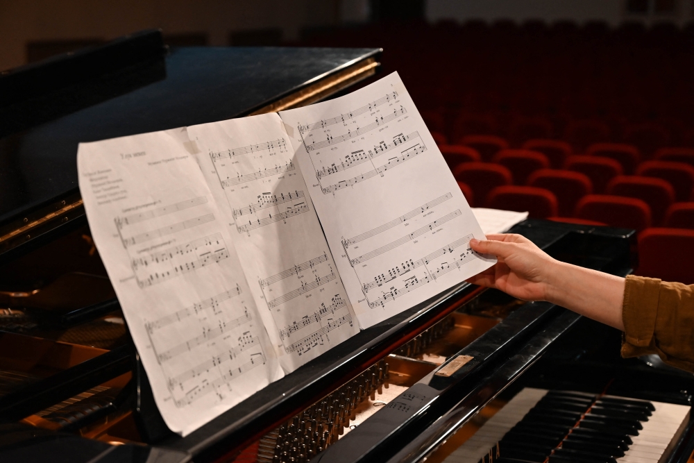 Nurzhyguit Moldoyar, singer, composer and student at the K. Moldobasanov Kyrgyz National Conservatory, who participates in a competition to create a new national anthem for Kyrgyzstan, together with fellow musicians and collaborators performs his composition he submitted to the contest, in Bishkek April 5, 2025. — AFP pic