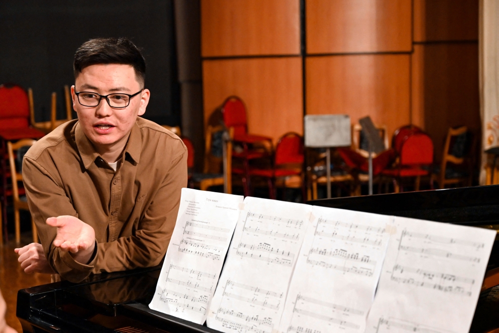 Nurzhyguit Moldoyar, singer, composer and student at the K. Moldobasanov Kyrgyz National Conservatory, who participates in a competition to create a new national anthem for Kyrgyzstan, together with fellow musicians and collaborators performs his composition he submitted to the contest, in Bishkek April 5, 2025. — AFP pic