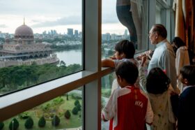 Datuk Seri Anwar Ibrahim and his grandchildren check out the view from the Prime Minister’s Office in Putrajaya. — Picture from Facebook/Anwar Ibrahim