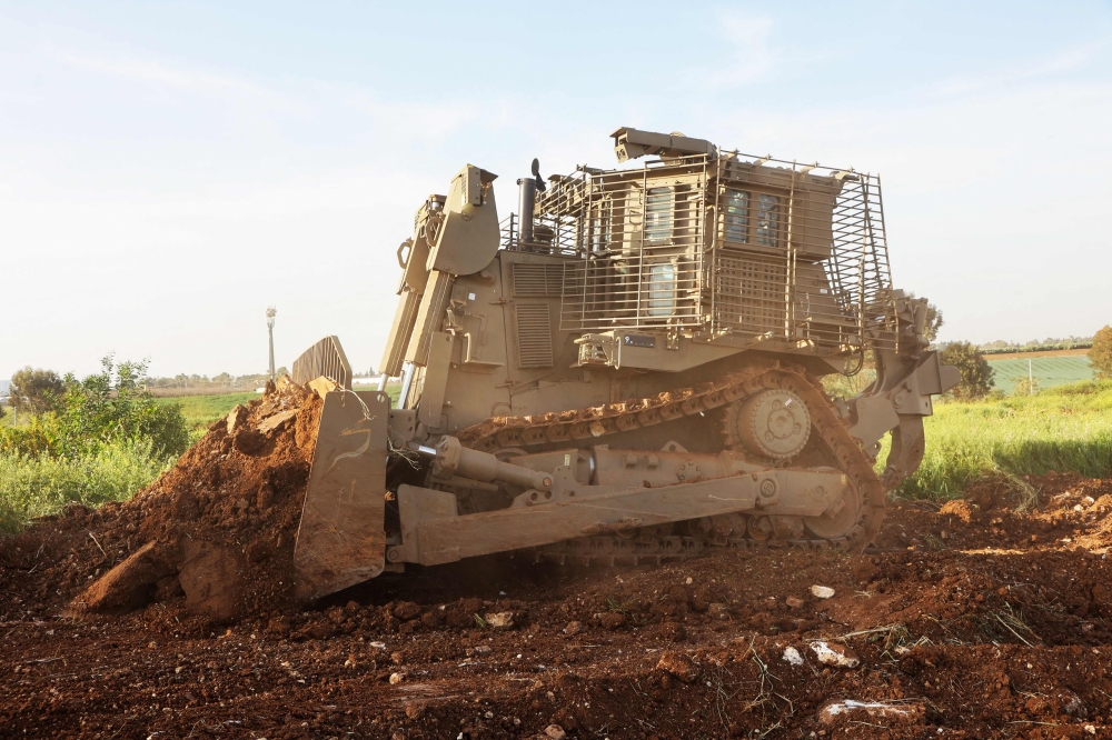 272395 An unmanned D9 bulldozer digs up a field during a demonstration to the press at the Israel Aerospace Industries (IAI) quarters near Tel Aviv on March 26, 2025. Israel's increasing use of advanced technology on the battlefield, from air defence systems to a broad range of AI-driven intelligence tools, has been well-documented but also criticised for inaccuracies, lack of human oversight and potential violations of international law. — AFP pic