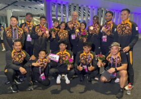 Robert Ballard (back row, fifth from right) is seeking legal advice to protect his reputation following allegations that Malaysian national athletes were threatened with removal for choosing not to train under the centralised system. — Picture from Facebook/Robert John Ballard
