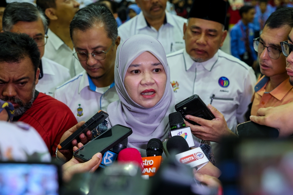 Education Minister Fadhlina Sidek speaking to reporters during the Symbolic Ceremony for the Wearing of the Jalur Gemilang Badge on School Uniforms at Sekolah Menengah Kebangsaan Datuk Haji Ahmad Badawi. — Bernama pic
