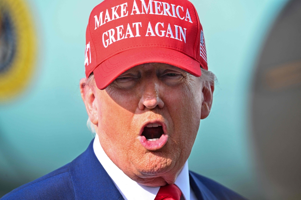 US President Donald Trump speaks to reporters after landing at the Palm Beach International Airport in West Palm Beach, Florida on February 16, 2025 after attending the Daytona 500 car race earlier in the day. Donald Trump’s first 100 days back in the US presidency have showcased his unique ability to shock — and sometimes entertain — with outrageous remarks that pull no punches. — AFP pic