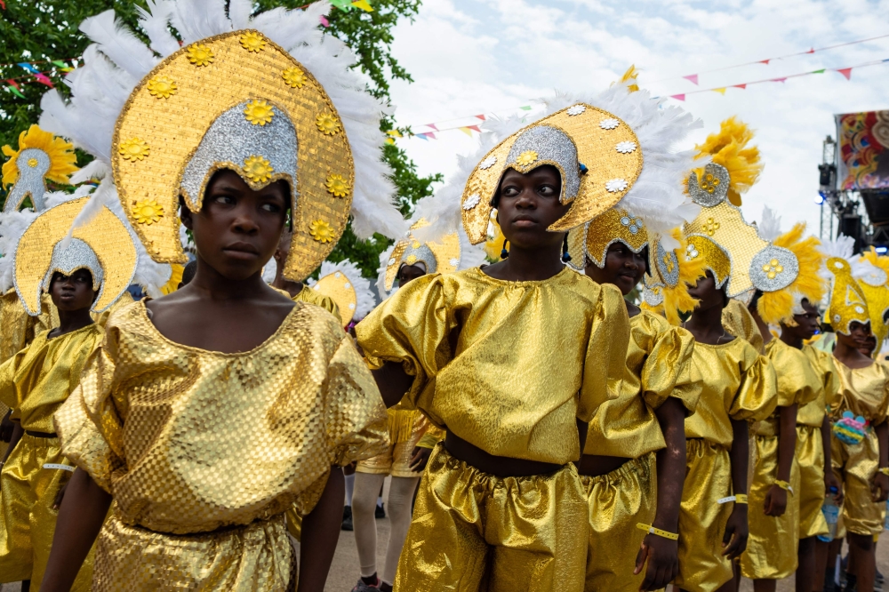 272503 After Brazil abolished slavery, some of the enslaved Africans returned to West Africa, settling in several countries including Nigeria and Sierra Leone. They brought with them Latin American food, religion and colour. On Sunday thousands of descendants of the freed slaves donned elaborate costumes at a colorful parade in Lagos to proudly keep their heritage alive. — AFP pic