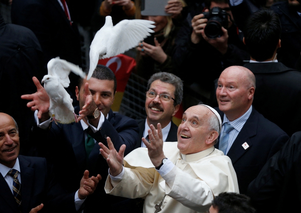 272571 Pope Francis releases a white dove prior to delivering a Holy Mass at the Catholic Cathedral of the Holy Spirit in Istanbul November 29, 2014. — Reuters pic
