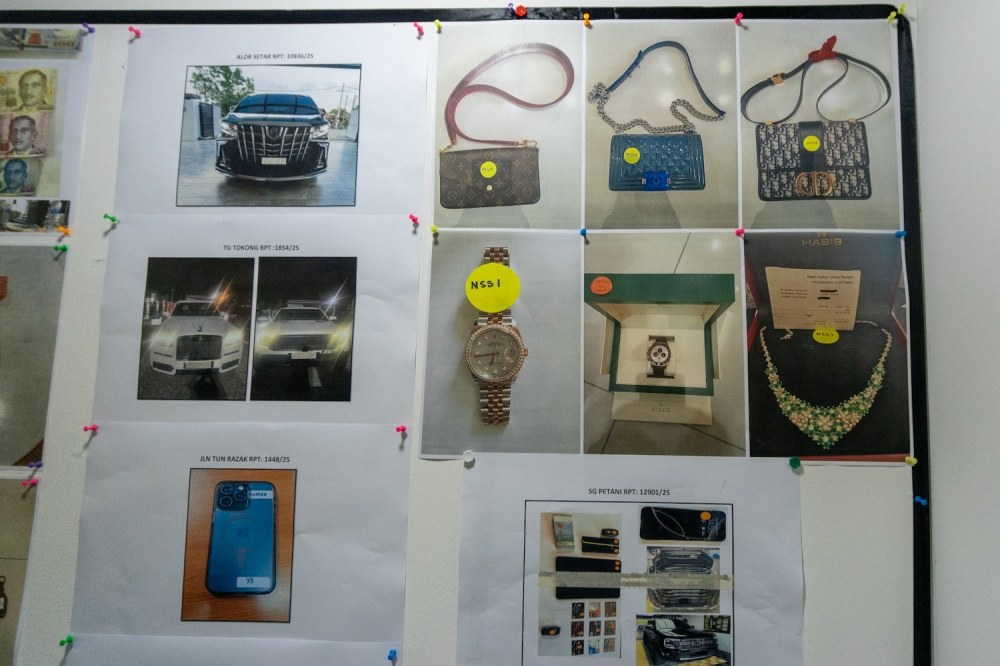 272720 A display showing luxury items and vehicles seized during Ops Northern Star in Kuala Lumpur April 22, 2025. — Picture by Raymond Manuel