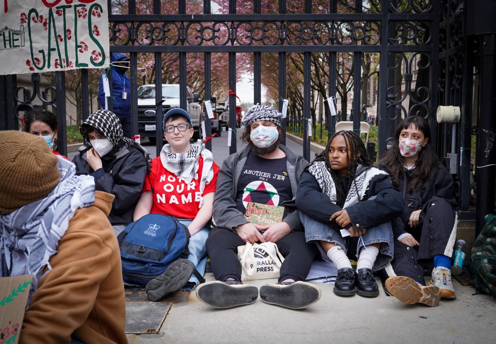 273339-1 Students demonstrate during a protest where some temporarily locked themselves to the gates to Columbia University’s main campus in New York City. — Reuters pic