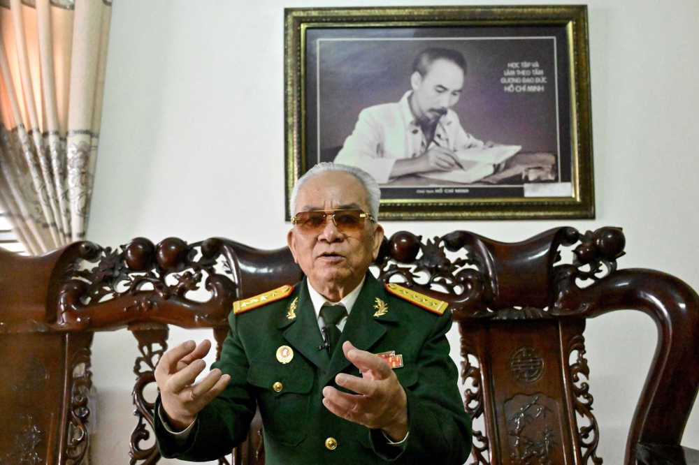 273836 Vu Dang Toan, former commander of the tank 390, speaks under a portrait of Ho Chi Minh during an interview at his home in Vietnam’s northern Hai Duong province March 10, 2025. — AFP pic