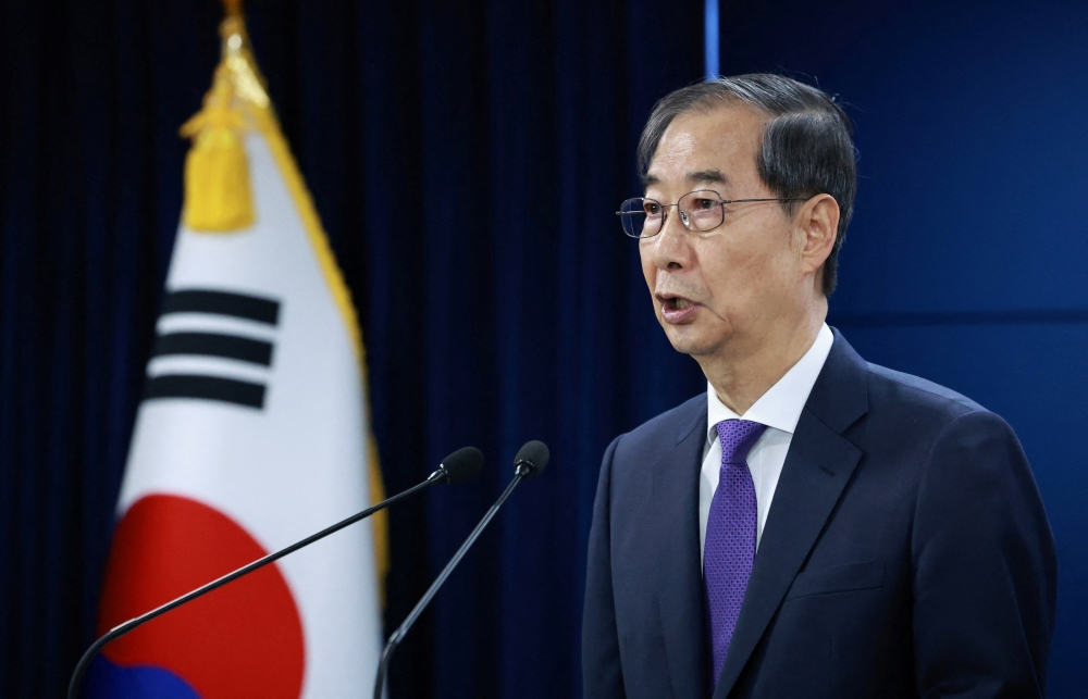 274551 South Korea's acting President Han Duck-soo speaks during a press conference in Seoul May 1, 2025. — Yonhap/Reuters pic