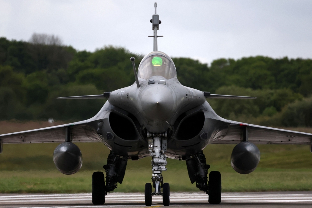 275973 A Rafale M takes part in a practice session for a simulated landing on an aircraft carrier in Saint-Servais, Brittany, France, May 7, 2025.— Reuters pic