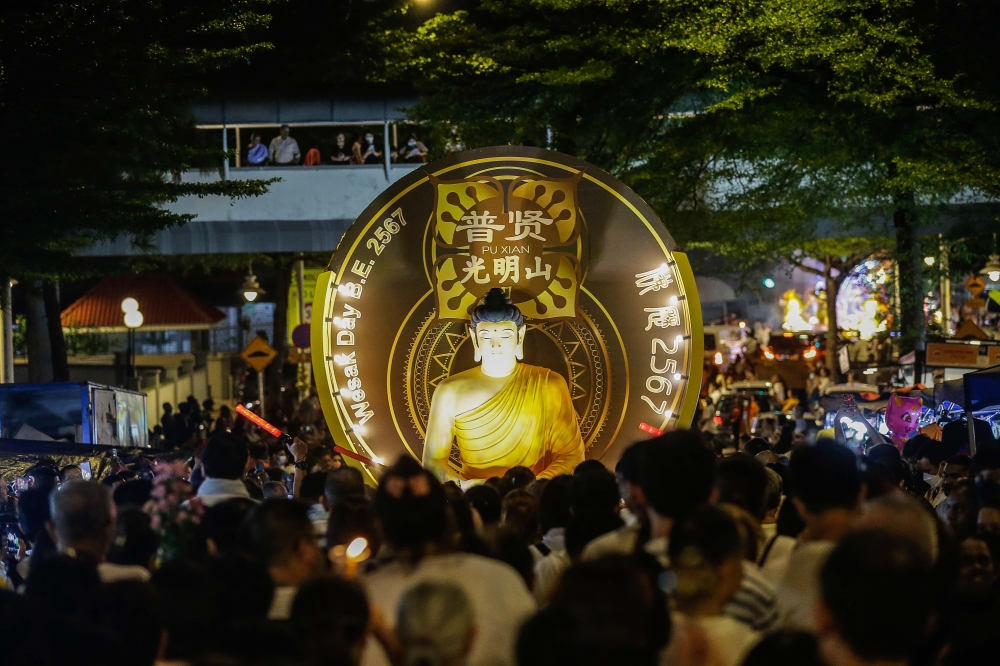 276313 Devotees blessed by Buddhist monks on the floats during the Wesak Day procession at the Maha Virana Buddhist Temple on Jalan Berhala, Brickfields in Kuala Lumpur. — Picture by Sayuti Zainudin