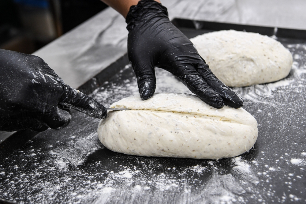 276382 Fresh sourdough bread being prepared for Yin’s Sourdough Bakery & Cafe in Kuala Lumpur. —Bernama pic