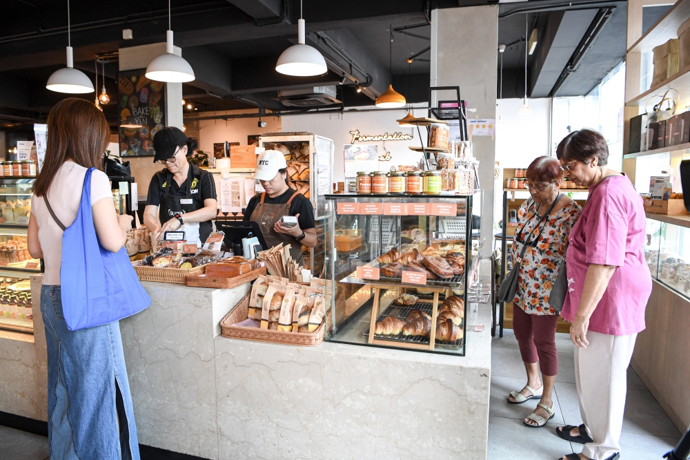 276383 Customers taking a look at their options at Yin’s Sourdough Bakery & Cafe, Kuala Lumpur during a recent Bernama visit. — Bernama pic
