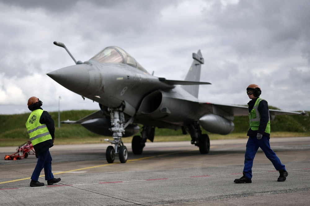 276437-1 A French fighter aircrafts Rafale M, manufactured by Dassault Aviaition, stands on the tarmac before a practice session for a simulated landing on an aircraft carrier at the Landivisiau Navy Air Base (BAN Landivisiau) in Saint-Servais, Brittany, France, May 7, 2025. — Reuters pic